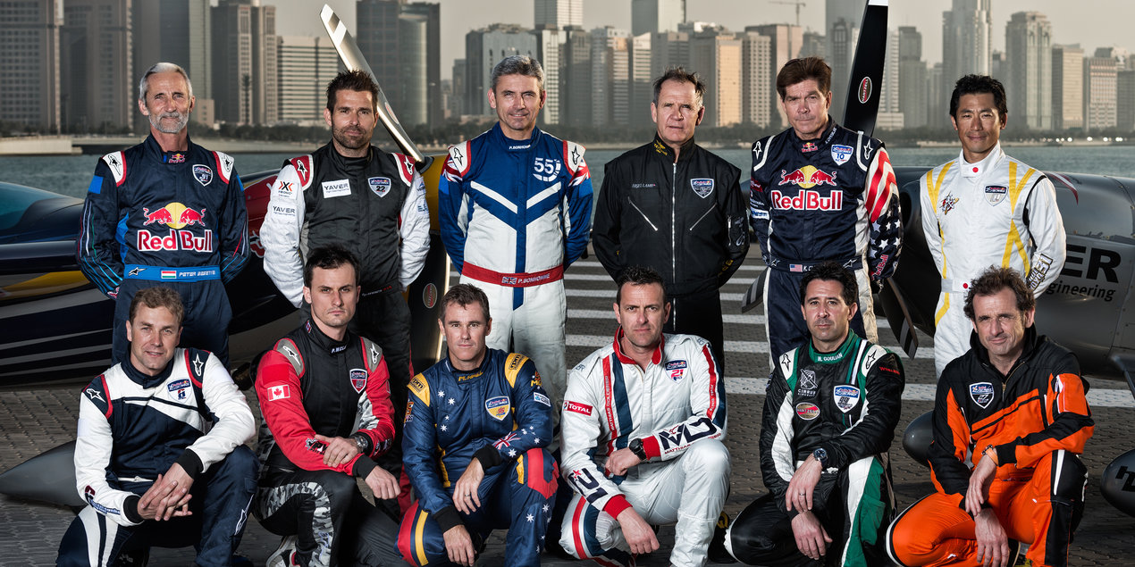 The pilots pose for a photograph during the Red Bull Air Race World Series in Abu Dhabi, United Arab Emirates on February 25, 2014.